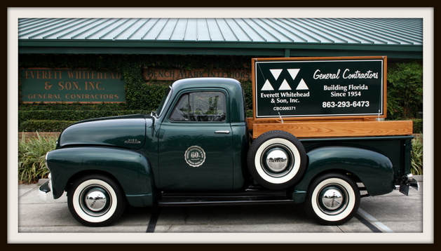 Framed Photo of Whitehead Construction Green Truck with Logo on the Side